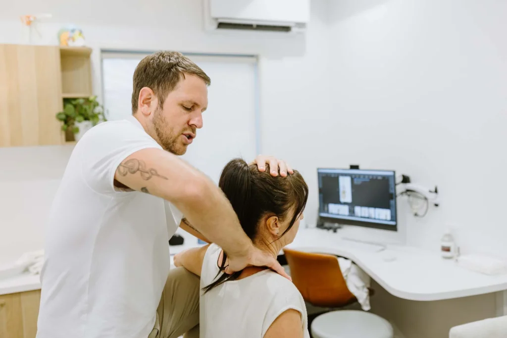 north coast head neck and jaw centre ballina osteopath Leon Erdrich treating a patient for neck pain in their northern rivers clinic in Ballina, NSW