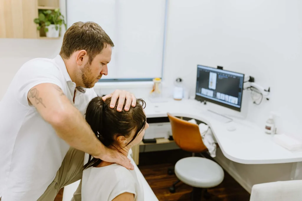 Female patient with chronic pain from whiplash sees Ballina Osteopath at the North Coast Head Neck and Jaw Centre which focuse on whiplash recovery
